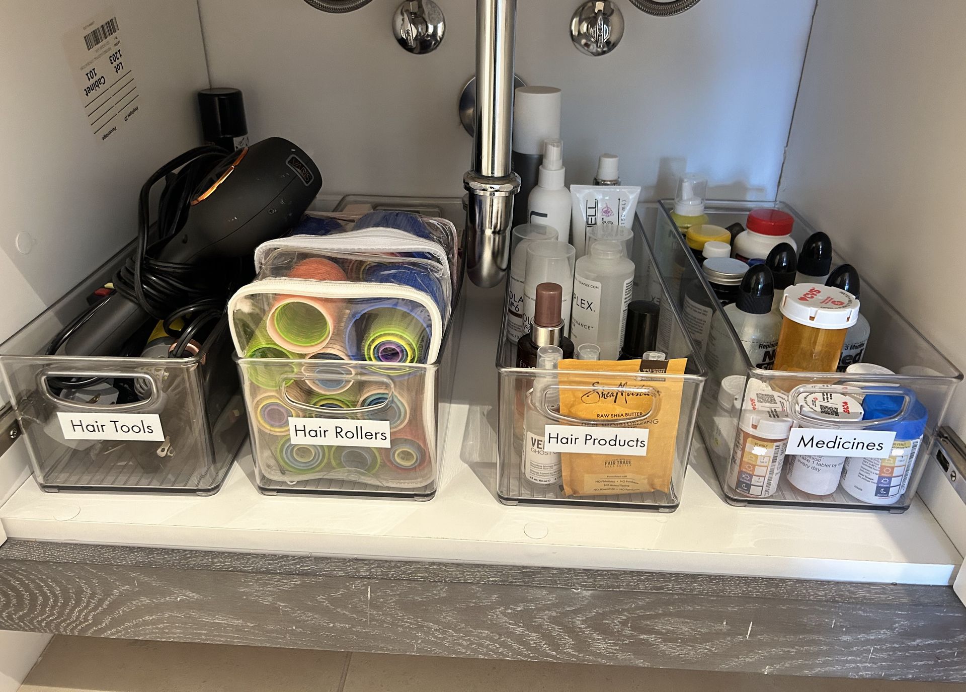 Under-sink bathroom organizer with labeled clear bins